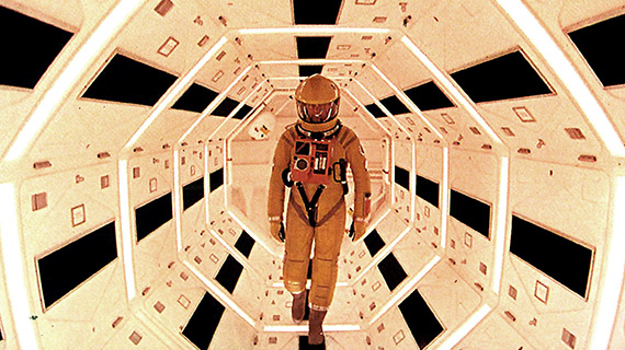 Dave Bowman walks a claustrophobic passageway within the spaceship Discovery in the film 2001.