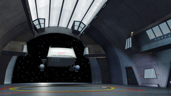 The Columbus enters the shuttle bay of the Enterprise on Star Trek.